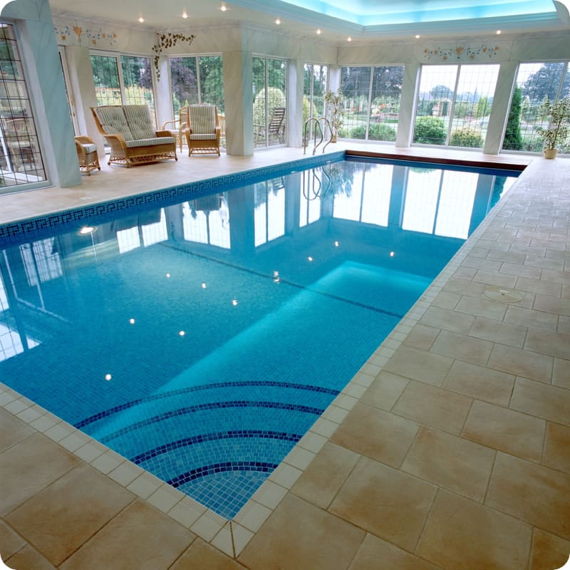 Indoor tiled pool with curved step entrance